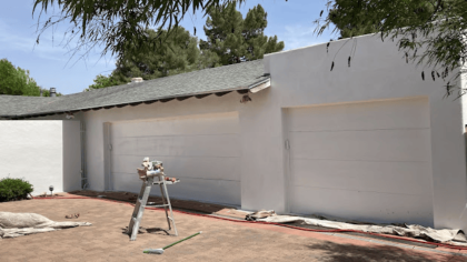 Fresh white paint on garage doors and walls.