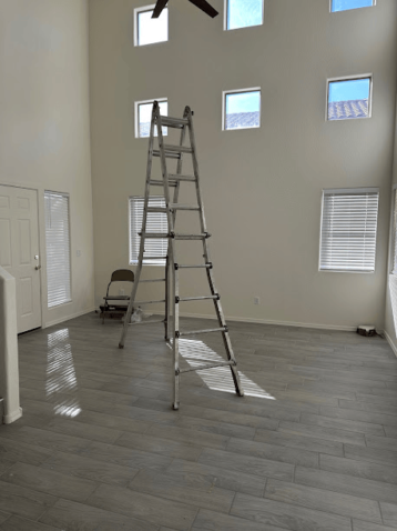 Room with ladder and freshly painted walls