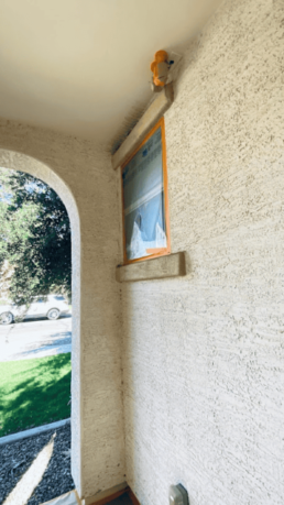 Exterior plaster wall with new paint