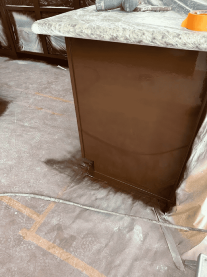 Kitchen cabinet being painted brown