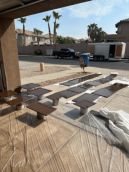 Painted cabinet doors drying outside.