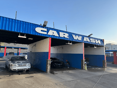 Freshly painted car wash with blue, white, and red accents.