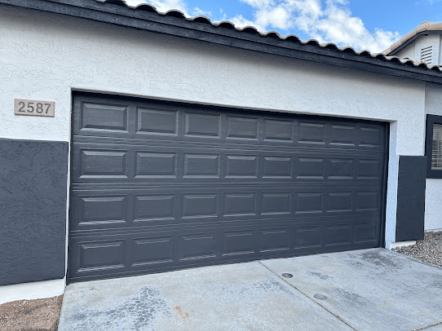 Freshly painted dark gray garage door.