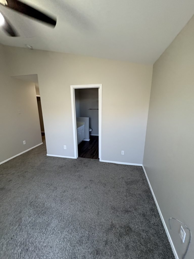 room with grey walls and carpet