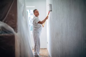 One man painting the walls